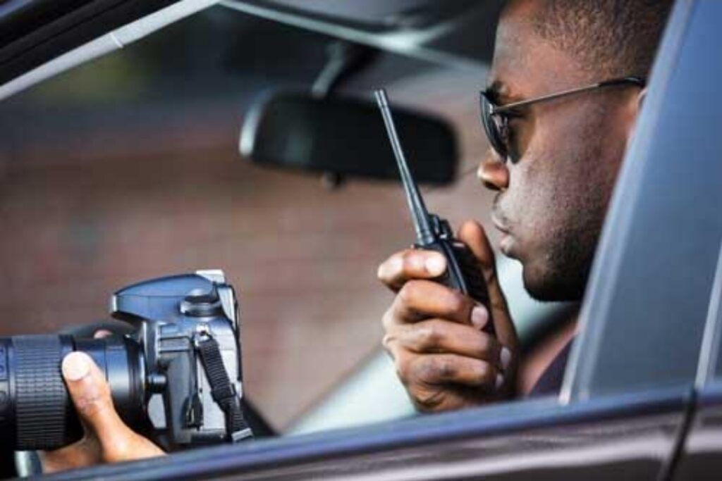 Private investigator conducting surveillance from a vehicle during an investigation in South Florida.